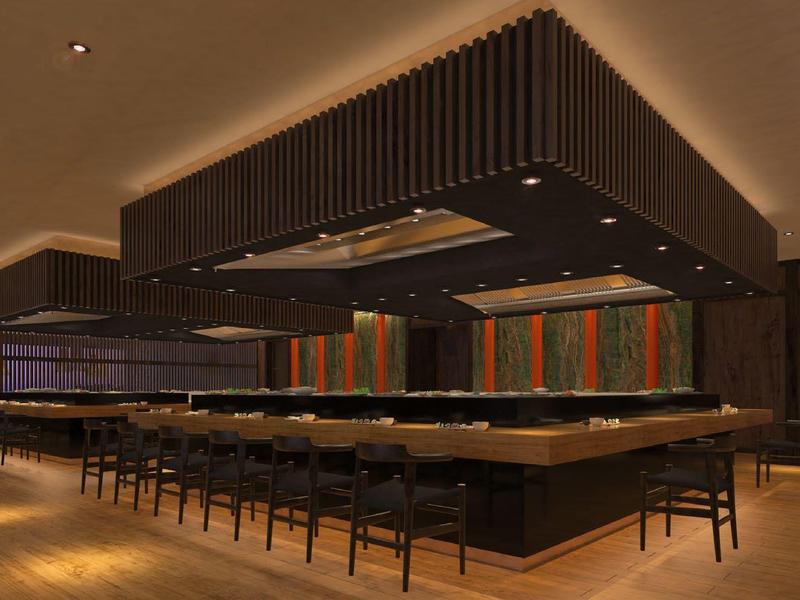 Moderner Barbereich mit schwarzem Tresen, Holzstühlen und warmen Beleuchtungselementen.