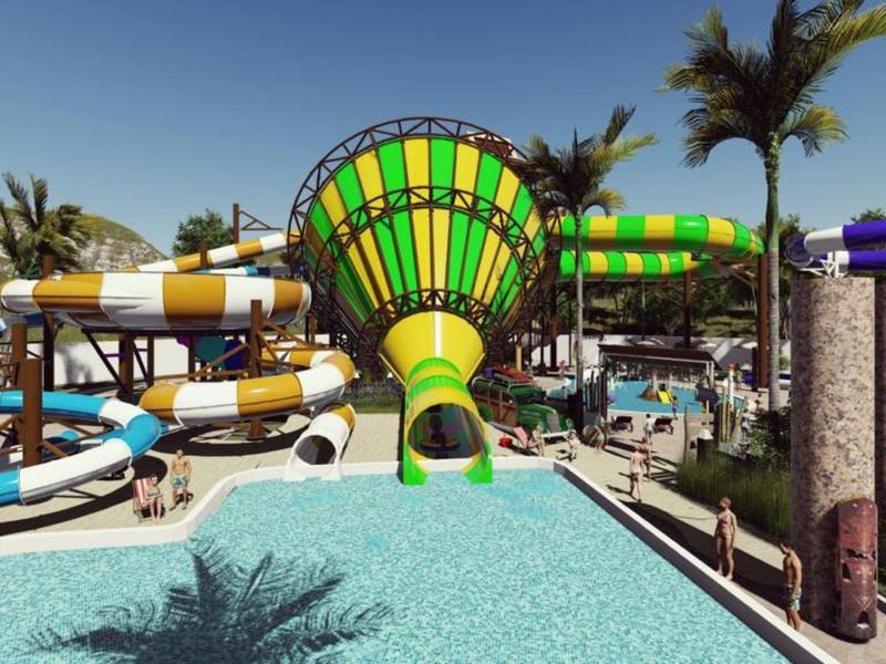 Buntes Wasserrutschenparadies mit tropischen Palmen und klarem blauen Wasser im Schwimmbecken.