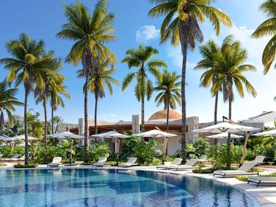 Hotel moderno con piscina e palme sotto un cielo azzurro limpido