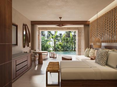 Modern ingerichte hotelkamer met uitzicht op een tropische tuin.