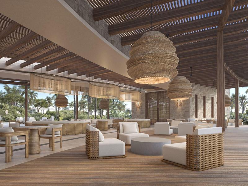 Moderne open lounge met houten plafond en comfortabele zitplaatsen in tropisch hotel.