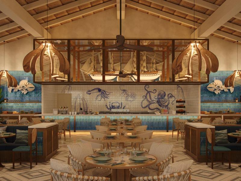 Ristorante elegante con legno chiaro, mobili in rattan e decorazioni murali marine
