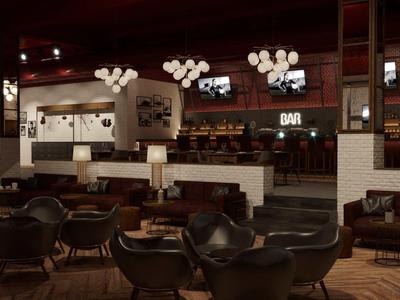 Bar dell'hotel moderno con poltrone marrone scuro, pavimento in legno e illuminazione accogliente.