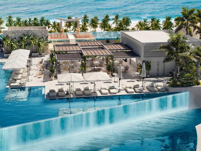 Luxusní hotel s infinity bazénem, vodopádem a výhledem na moře.