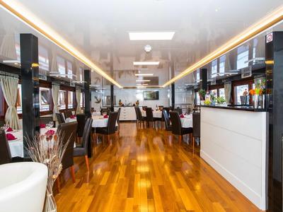 Modern and elegant dining area with wooden flooring and stylish seating