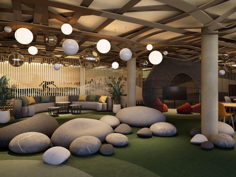 Modern gestalteter Innenraum mit runden Sitzkissen, Säulen und hängenden Kugelleuchten.