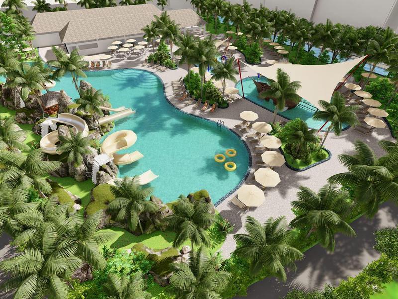 Großer Pool mit Wasserfall, Sonnensegel, Liegen und dichtem Palmen- und Pflanzenbewuchs drumherum.