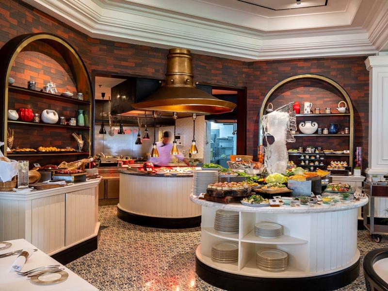 Buffet area with a rich selection of food in an elegant restaurant.