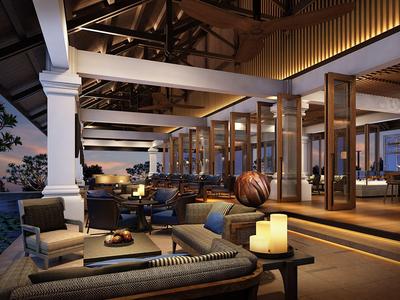 Moderne Terrassenlounge mit bequemen Sofas, warmem Licht und Meerblick bei Abenddämmerung.