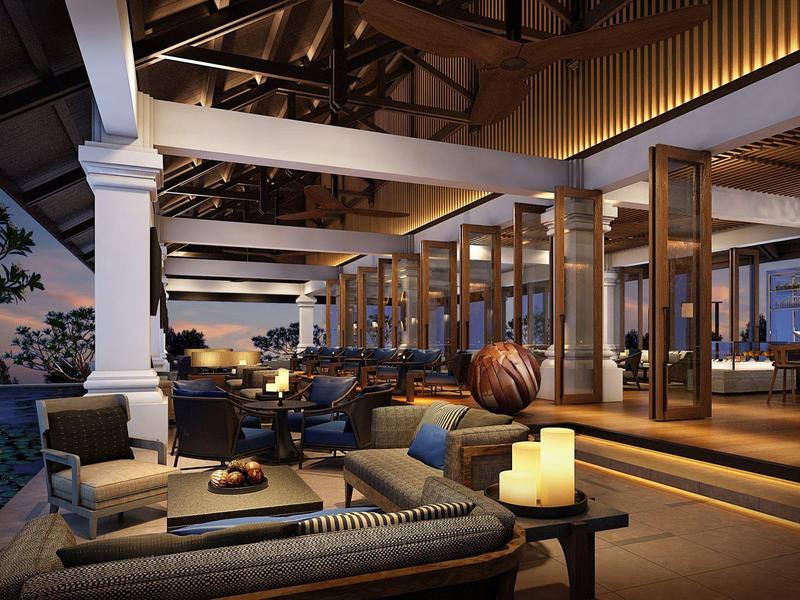 Espace lounge moderne d'hôtel avec sièges confortables et éclairage d'ambiance nocturne.