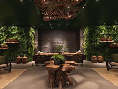 Luxuriöser Hotel-Loungebereich mit natürlichem Holz, grüner Wandbegrünung und gedämpfter Beleuchtung.