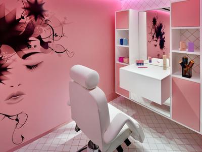 Modern hair salon with white chair and pink wall art design.