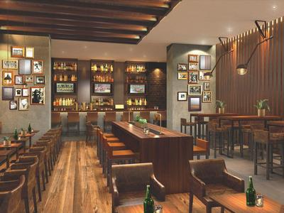 Elegant hotel bar with wooden furniture, warm lighting, and framed pictures on the walls.