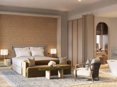 Elegantes Hotelzimmer mit Doppelbett, freistehender Badewanne und Sitzbereich in warmen Farbtönen.