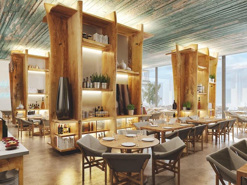 Bright hotel restaurant area with wooden fixtures and spacious seating.