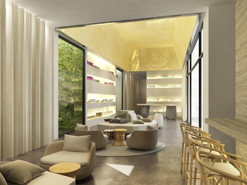 Elegant lounge area with seating, tall window, and bar stools in a hotel.