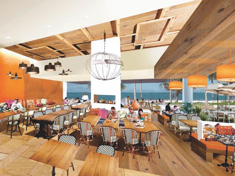 Modernes Restaurant mit Holzböden, orangenen Wänden und großem Ausblick auf Terrasse und Meer.