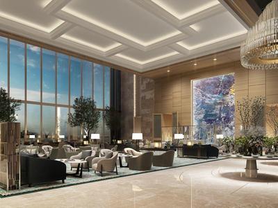 Spacious hotel lobby with glass windows, modern furniture, and elegant chandeliers.