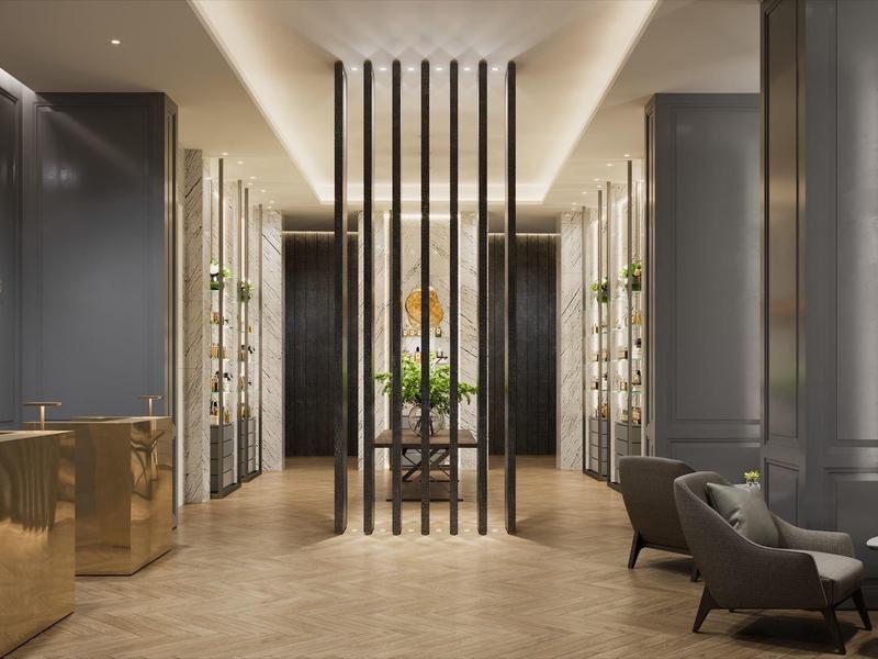 Moderner, eleganter Salon mit grauen Wänden, goldenen Akzenten und bequemen Sitzgelegenheiten.