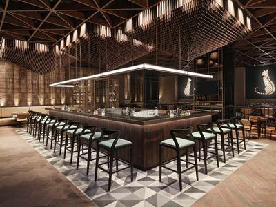 Moderner Barbereich mit dunklem Holz, hohen Stühlen und geometrischem Bodenmuster in warmem Licht.