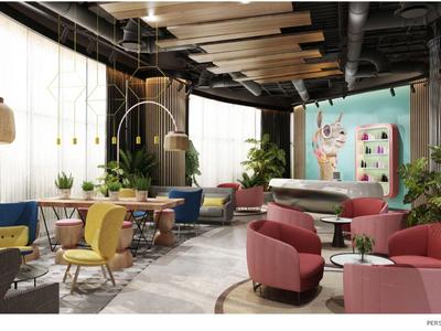 Nowoczesna przestrzeń lounge hotelu z kolorowymi fotelami i dużymi oknami