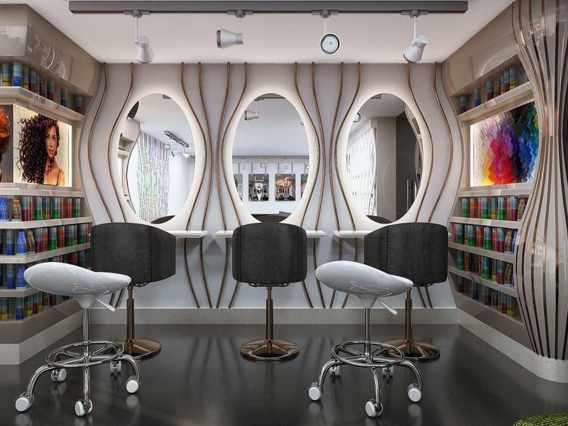 Moderner Frisörsalon mit runden Spiegeln, zwei weißen Stühlen und bunten Farbregalen an der Wand.