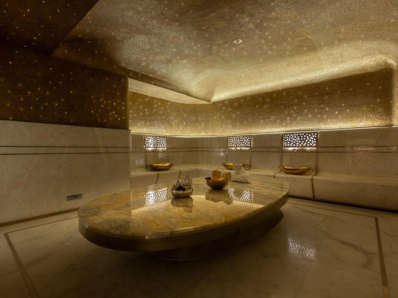 Modernly designed wellness room with soft lighting and marble interior.