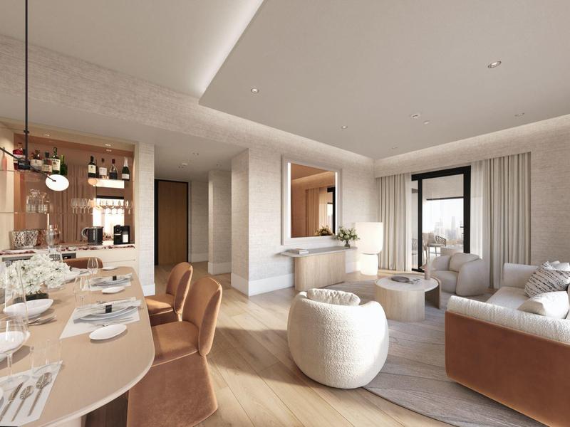 Elegancki nowoczesny salon z stołem jadalnym, wygodnymi fotelami i jasną drewnianą podłogą.