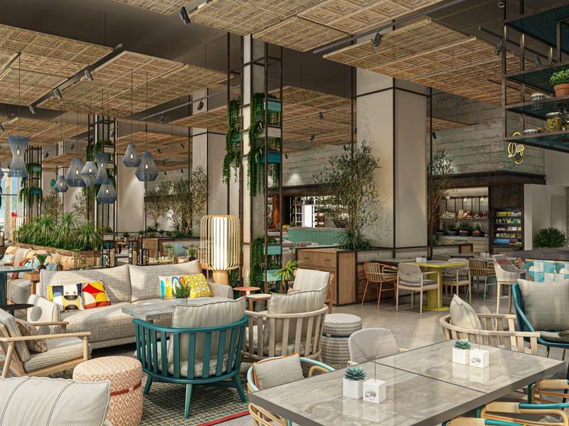 Světá, moderní hotelová restaurace s pohodlnými posezeními a spoustou zeleně.