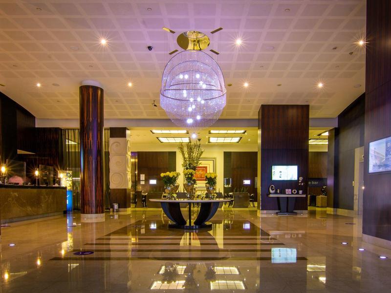 Elegant and spacious hotel lobby with modern design and warm lighting