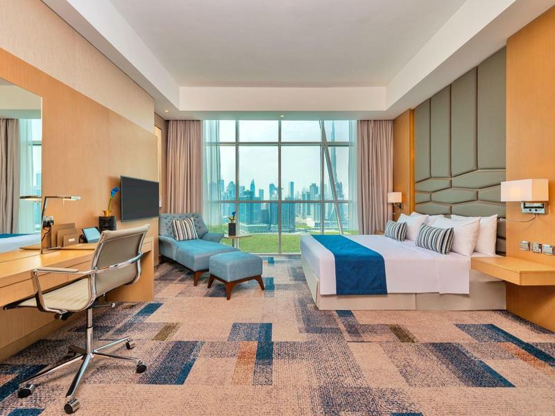 Modern hotel room with large window and city view