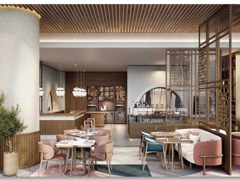 Modern hotel restaurant area with elegant furniture, wooden ceiling, and stylish decorations.