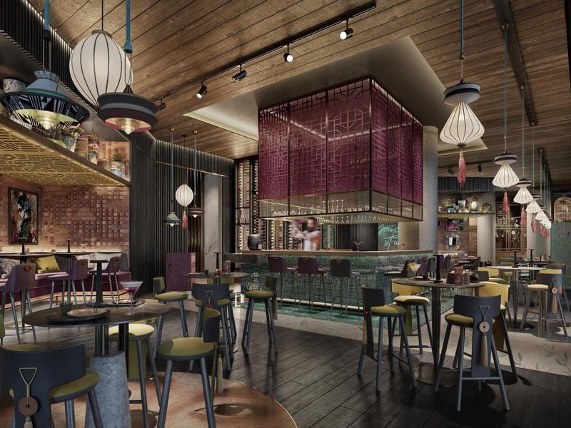 Modern hotel bar area with wooden ceiling, stools, and unique lamps in a warm ambiance.