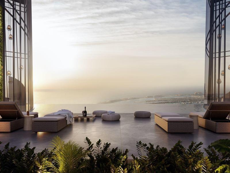 Luxe terras met zwembad en zeezicht bij zonsopgang.