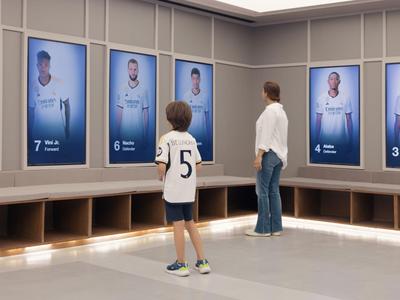Two people are viewing a wall with digital portraits and numbers in a modern room.