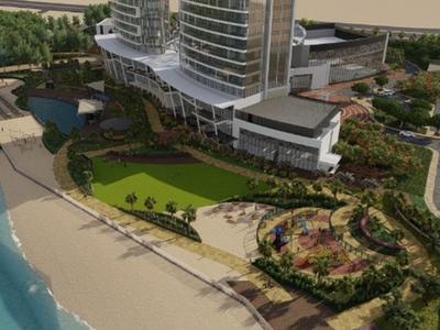 Luxuriöses Hotel mit zwei hohen Glasgebäuden, umgeben von Grünflächen und Strand am Wasser.