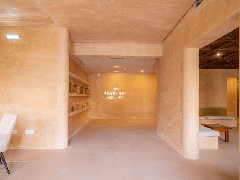 Brightly lit modern room with soft beige walls and minimalist design.