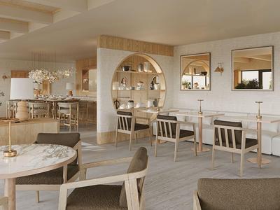Modern eingerichteter Hotel-Loungebereich mit hellen Holzmöbeln und dekorativem Wandregal.