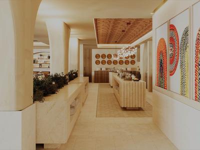 Moderner Hotel-Flur mit eingebauten Sitzbänken und bunten Wandkunstwerken auf der rechten Seite.