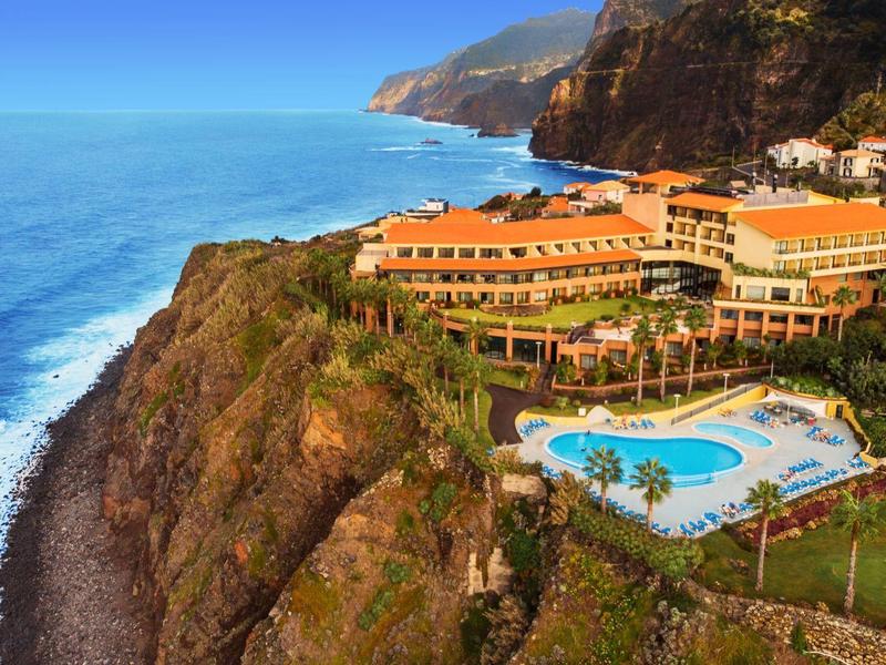Hotel complex with pool on cliff overlooking the sea and surrounding rocks