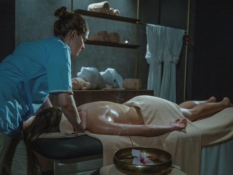 Massage in a spa room with calm lighting and a relaxing atmosphere.