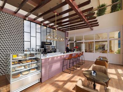 Modernes Café mit großem Tresen, Hockern, Vitrine voller Backwaren und Holzbalkendecke.