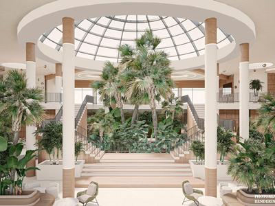 Helles Atrium mit großer Glaskuppel, Palmen und Treppe in einem Hotel