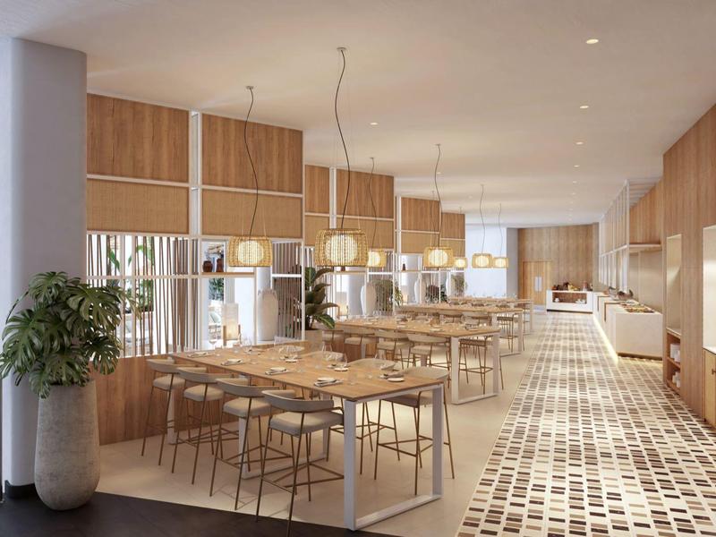 Modern, helder restaurant met houten muren, lange tafels en grote ramen.