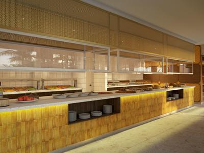 Modern hotel buffet with warm lighting and neatly arranged dishes under glass covers.