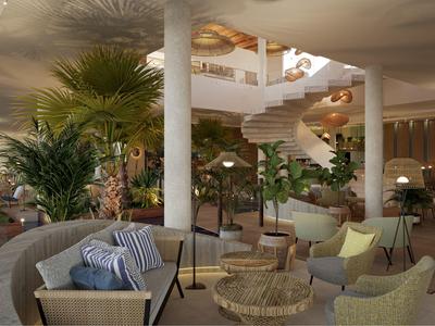 Cozy hotel lounge with plants, wicker furniture, and spiral staircase under natural lighting.