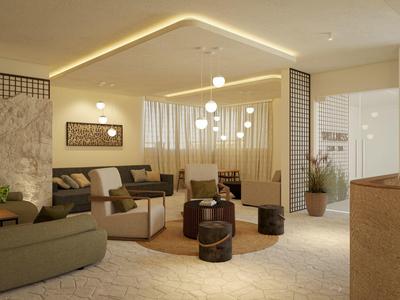Cozy hotel lounge with modern seating, warm lighting, and decorative elements creating a relaxing atmosphere.