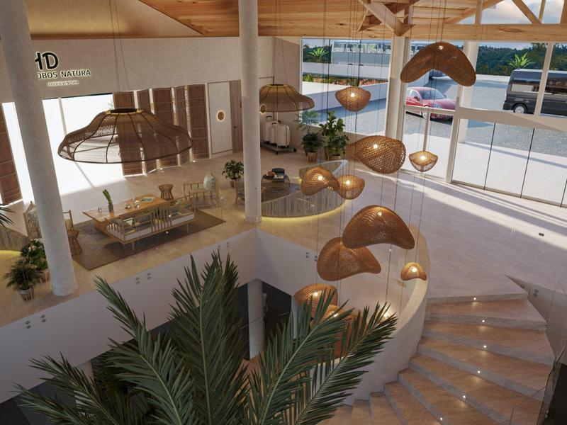 Modern hotel lobby with curved staircase, hanging lights, and large windows overlooking a pool.