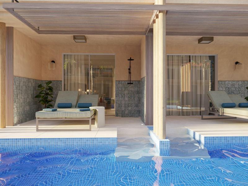 Two poolside cabanas with seating and clear reflections in a blue swimming pool.