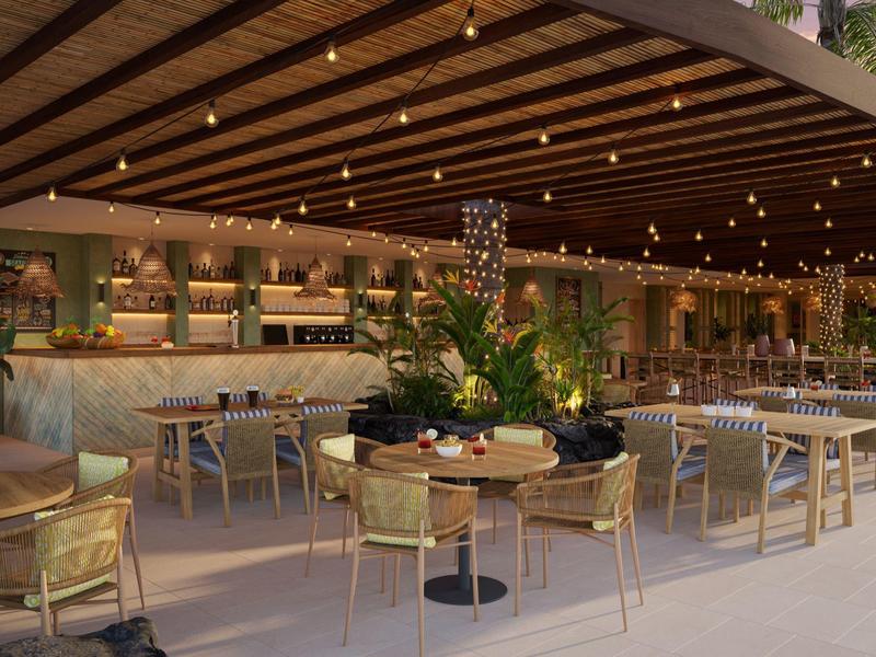 Spacious open-air restaurant with wooden ceiling, hanging lights, and modern tables with chairs.